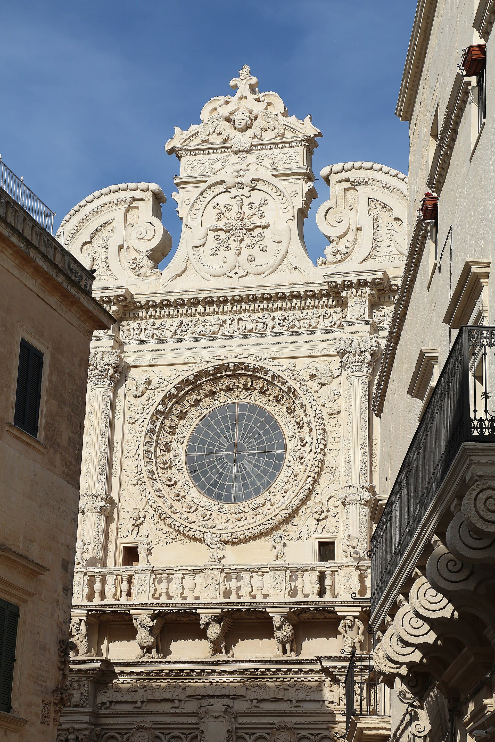 The carved baroque facade and rose window of the Basilica di Santa Croce, Lecce